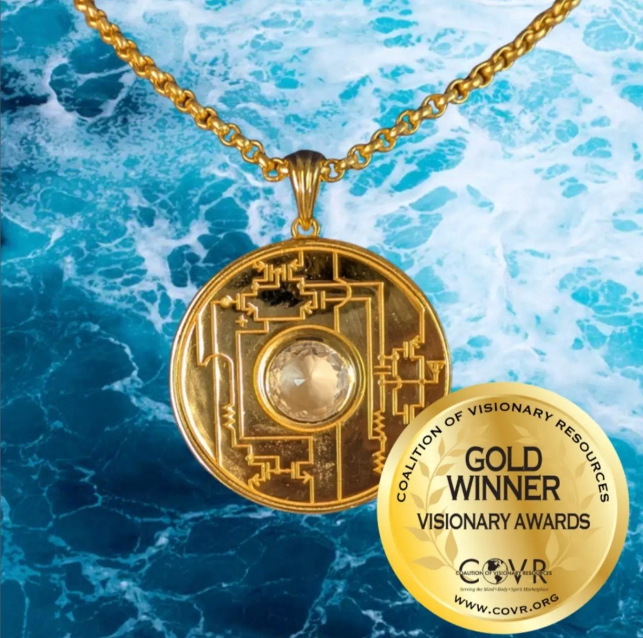 Harmonized Amplifier pendant in front of waves with COVR Gold Winner Visionary Awards sticker